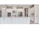 Modern kitchen with an oversized island, stainless steel appliances, and bright white cabinets at 26908 Victoria Pl, Punta Gorda, FL 33955