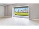 Open concept living area featuring hardwood floors, leading to an outdoor patio at 26908 Victoria Pl, Punta Gorda, FL 33955