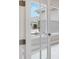 Office space with white french doors and a bright window offering a view of the outdoors at 26908 Victoria Pl, Punta Gorda, FL 33955