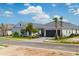 Street view of single-story homes with well-maintained landscaping and grey roofs at 26930 Lark Ct, Punta Gorda, FL 33955
