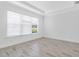 Bright bedroom with large window, crown molding, and stylish flooring creates a cozy atmosphere at 26936 Lark Ct, Punta Gorda, FL 33955