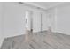 Inviting bedroom with sleek flooring and an open doorway to a contemporary bathroom at 26936 Lark Ct, Punta Gorda, FL 33955