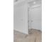 Clean hallway with stylish flooring and doors, offering easy access throughout the home at 26936 Lark Ct, Punta Gorda, FL 33955