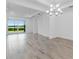Bright living room with tile flooring and sliding glass doors to the backyard, offering a seamless indoor-outdoor flow at 26936 Lark Ct, Punta Gorda, FL 33955