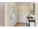 Bright entryway with decorative glass door, stylish console table, and modern accents at 3285 Datura Rd, Venice, FL 34293