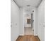 Hallway view leading into the bathroom area, showcasing updated finishes and ample space at 3417 Tallywood Ln, Sarasota, FL 34237
