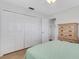 Bright bedroom featuring wooden floors, ample closet space and a wooden dresser at 3708 Chinaberry Rd, Bradenton, FL 34208