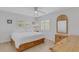 Bright bedroom with ample natural light, neutral walls, and a ceiling fan at 3708 Chinaberry Rd, Bradenton, FL 34208