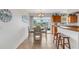 Bright dining area adjacent to the kitchen, featuring modern table and chairs and access to the outdoors at 3708 Chinaberry Rd, Bradenton, FL 34208