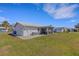 A photo of the exterior rear of the building, with the air conditioner and enclosed patio visible at 3708 Chinaberry Rd, Bradenton, FL 34208