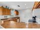 Kitchen with oak cabinets, laminate countertops, and a double stainless steel sink at 3708 Chinaberry Rd, Bradenton, FL 34208
