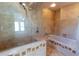 Luxurious bathroom with marble accents, a bathtub, and a frameless glass shower at 3739 Kingston Blvd, Sarasota, FL 34238