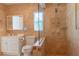 Luxurious bathroom with marble accents, a frameless glass shower, toilet, and sink at 3739 Kingston Blvd, Sarasota, FL 34238