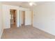Spacious bedroom with carpet and a view to the luxurious bathroom with marble accents at 3739 Kingston Blvd, Sarasota, FL 34238