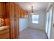 Bright dining area with built in cabinets next to the kitchen at 3739 Kingston Blvd, Sarasota, FL 34238