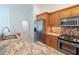 Bright kitchen with stainless steel appliances and granite countertops at 3739 Kingston Blvd, Sarasota, FL 34238
