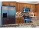 Kitchen features stainless steel appliances and a mosaic backsplash at 3739 Kingston Blvd, Sarasota, FL 34238
