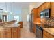 Open kitchen view showcasing granite countertops and stainless appliances at 3739 Kingston Blvd, Sarasota, FL 34238