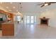 Bright living area with tile flooring, pendant lighting, and a cozy fireplace feature at 3739 Kingston Blvd, Sarasota, FL 34238