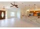 Open-concept living area with tile flooring and a kitchen bar at 3739 Kingston Blvd, Sarasota, FL 34238