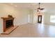 Spacious living room featuring a fireplace and neutral tile floors at 3739 Kingston Blvd, Sarasota, FL 34238