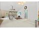 Spacious living room with carpet, flatscreen TV, vaulted ceiling, fan, and natural light at 406 116Th E St, Bradenton, FL 34212