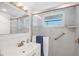 Beautifully updated bathroom with glass shower and decorative tile at 4390 Exeter Dr # I305, Longboat Key, FL 34228