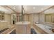 Bright bathroom with a soaking tub, double sink vanity, and large mirrors at 4473 Gulf Of Mexico Dr, Longboat Key, FL 34228