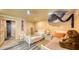 bedroom with two twin beds, ceiling fan and colorful decor at 4473 Gulf Of Mexico Dr, Longboat Key, FL 34228
