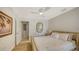 Bright bedroom with ceiling fan, neutral tones, ensuite bath, a tranquil retreat for relaxation at 4473 Gulf Of Mexico Dr, Longboat Key, FL 34228