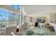 Dining room with tall windows and views of waterfront at 4473 Gulf Of Mexico Dr, Longboat Key, FL 34228