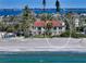 Stunning beachfront home with a red tile roof and beautiful views of the ocean at 4473 Gulf Of Mexico Dr, Longboat Key, FL 34228