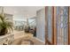 Inviting foyer with a decorative door, open staircase, and a glimpse into the open-concept home at 4473 Gulf Of Mexico Dr, Longboat Key, FL 34228