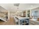 Modern kitchen with island seating, stainless steel appliances, and built-in window seating at 4473 Gulf Of Mexico Dr, Longboat Key, FL 34228