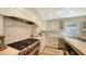 Modern kitchen with stainless steel appliances, custom backsplash, and ample countertop space at 4473 Gulf Of Mexico Dr, Longboat Key, FL 34228
