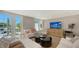 Inviting living room with ample natural light and refined furnishings at 4473 Gulf Of Mexico Dr, Longboat Key, FL 34228