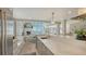 Open-concept layout shows the dining area, kitchen and living spaces at 4473 Gulf Of Mexico Dr, Longboat Key, FL 34228