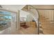 Bright and airy living area with workspace, stairs and fireplace visible at 4473 Gulf Of Mexico Dr, Longboat Key, FL 34228