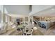 Open-concept living space with dining area, staircase, kitchen, and living room at 4473 Gulf Of Mexico Dr, Longboat Key, FL 34228