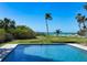 Refreshing pool with lush landscaping, offering a serene outdoor experience at 4473 Gulf Of Mexico Dr, Longboat Key, FL 34228
