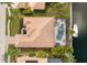 Stunning aerial view of the home showing a private pool, boat dock and meticulous landscaping at 4721 Mainsail Drive, Bradenton, FL 34208