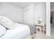 Bright bedroom with white walls, carpet, and a vanity and dressing table at 4721 Mainsail Drive, Bradenton, FL 34208