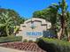 Community entrance sign 'The Inlets at Riverdale' with beautiful landscaping and tropical plants at 4721 Mainsail Drive, Bradenton, FL 34208