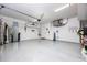Clean and spacious garage with white epoxy floor, offering ample room for parking and additional storage solutions at 4721 Mainsail Drive, Bradenton, FL 34208