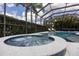 Inviting hot tub with bubbling water and screened enclosure, perfect for relaxation and enjoying the outdoors at 4721 Mainsail Drive, Bradenton, FL 34208
