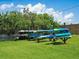 Community kayak storage area with multiple kayaks stacked and ready for water adventures at 4721 Mainsail Drive, Bradenton, FL 34208