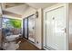 Charming entrance featuring white patio furniture and a view into the dining area at 6650 Schooner Bay Cir # 6650, Sarasota, FL 34231