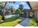 Inviting front yard with lush landscaping and a well-manicured lawn at 6650 Schooner Bay Cir # 6650, Sarasota, FL 34231