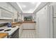 Functional kitchen with white cabinets, white appliances, and wood countertops at 6650 Schooner Bay Cir # 6650, Sarasota, FL 34231