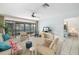 Relaxing living room featuring a sliding glass door to outdoor patio, with cozy furnishings and stylish accents at 6650 Schooner Bay Cir # 6650, Sarasota, FL 34231